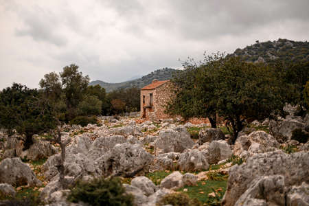 old stone building in the magnificent stony meadow in the mountainsの写真素材