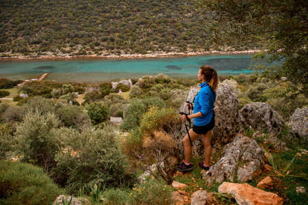 view of handsome woman against the background of beautiful landscapeの写真素材