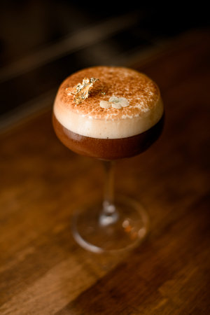 selective focus on a beautiful foamy drink in wine glass