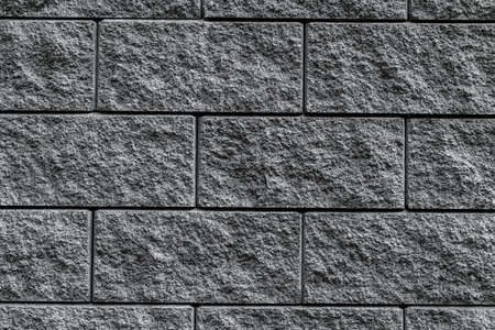 Close-up of the surface of the rough concrete slabs, arranged in a row. Top view.の写真素材