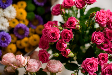 Close-up top view of bunch of beautiful fresh small pink rose flowers.の写真素材