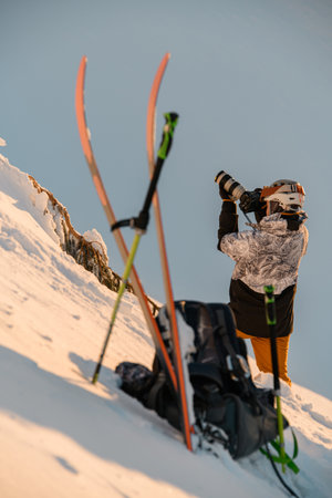 view of male photographer with photo camera on mountain slope.の写真素材