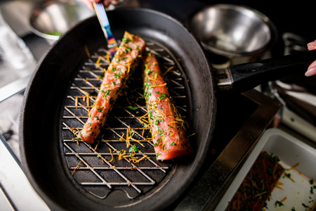 Top view of two grilled red fish salmon steaks on cast iron skillet panの写真素材
