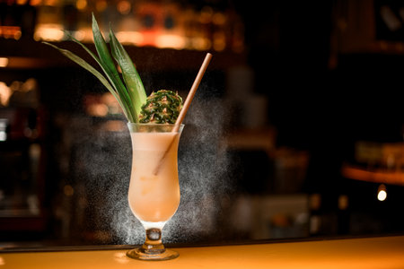 Pina colada delicious cocktail on bar counter. Cocktails at the disco. Cocktail with rum, pineapple juice, condensed milk, classic basic cocktails.の写真素材