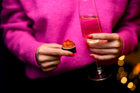 Savoring the Moment. A Girl, Sushi, and Champagneの写真素材