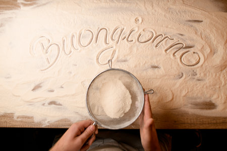 Flour artistry. Buongiorno greetings amid flourの写真素材