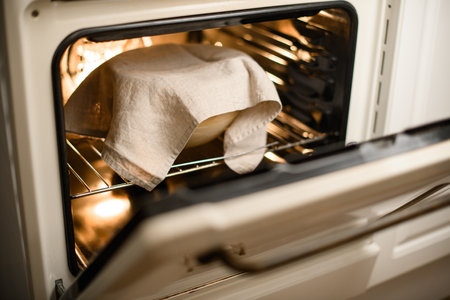 Baking in the oven, covered with a natural white clothの写真素材