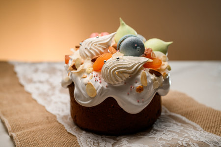 Close-up of beautiful cake with meringues, macarons and fruits