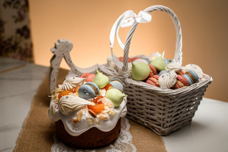 Cake filling on white lace and rough burlap fabric and a basket of macaroons