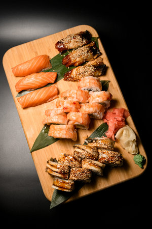 Sushi roll set consisting of grilled nigiri and tuna rolls, shrimp philadelphia and salmon nigiriの写真素材