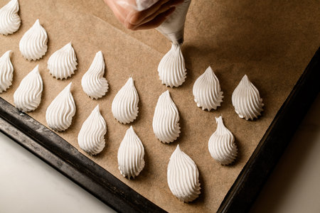 Pastry bag at work. Shaping delightful sweets with expertise