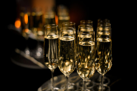 Several glasses of champagne on a tray for a buffet tableの写真素材