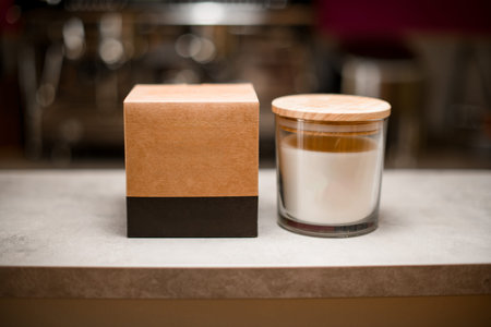 Soy scented candle in a glass jar with a lid