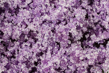 Sweet delicious delicate almond flour macaron sugar mixture in soft lilac, purple and plum color