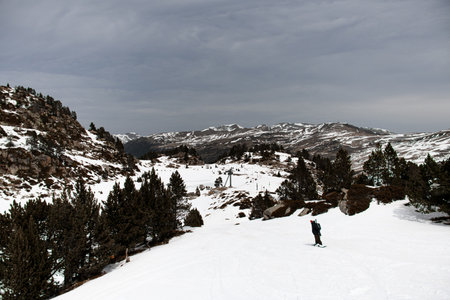 High angle view young skier descends on one of the slopes on a splitboardの写真素材