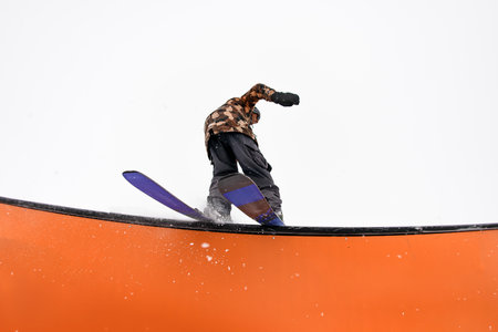 Skier conquers wallride. Dynamic tricks with seamless balance and precision.の写真素材