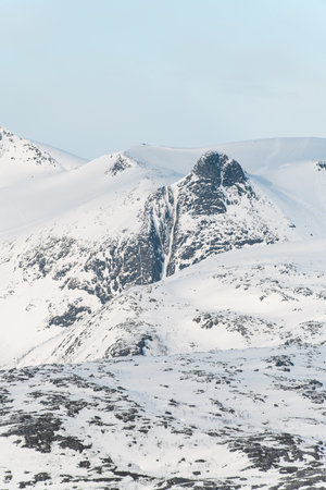 Mesmerizing landscape of spring mountains, which are still mostly covered with snowの写真素材
