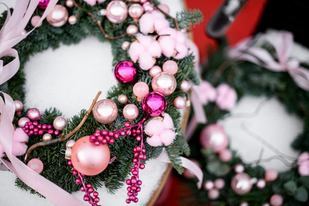Top view of two Christmas wreaths made of Christmas tree branches, focus on the foregroundの写真素材