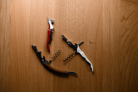 Three different corkscrews for opening corked wine are chaoticallyの写真素材