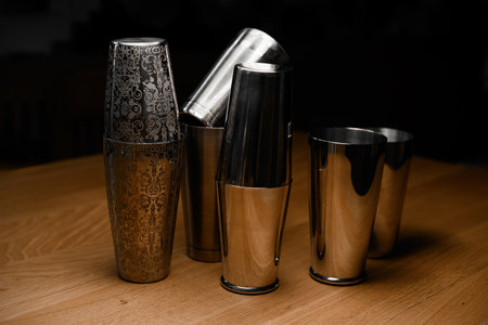 Four different shakers sit on the bar, some of them disassembledの写真素材