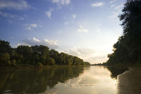 Peaceful scenic view of river and landscape in Summerの写真素材