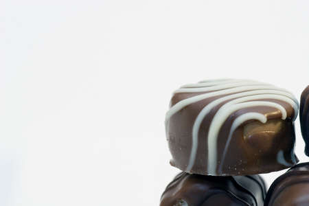 Chocolate bonbons in the white backgroundの写真素材