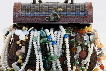 Chest full of jewelry treasures. Isolate on whiteの写真素材