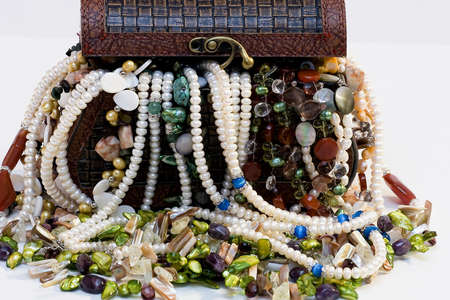 Chest full of jewelry treasures. Isolate on whiteの写真素材