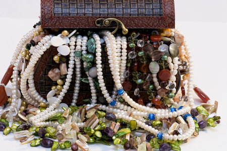 Chest full of jewelry treasures. Isolate on whiteの写真素材