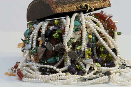 Chest full of jewelry treasures. Isolate on whiteの写真素材