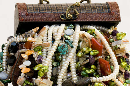 Chest full of jewelry treasures. Isolate on whiteの写真素材