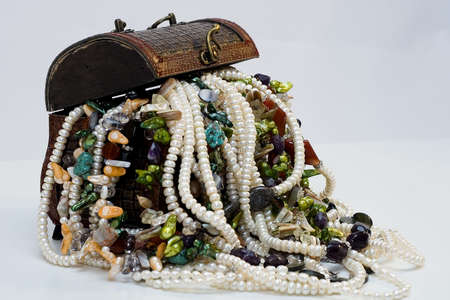 Chest full of jewelry treasures. Isolate on whiteの写真素材