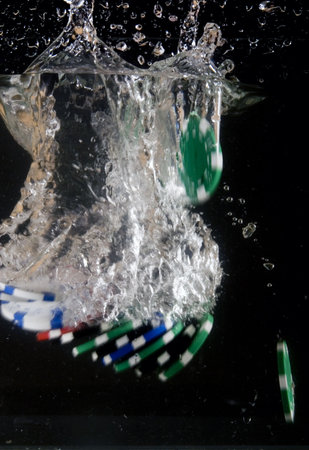 poker chip falling into water