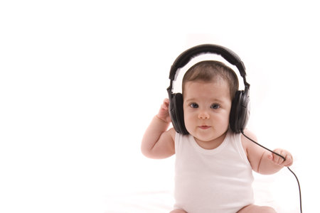 little girl listening to musicの写真素材