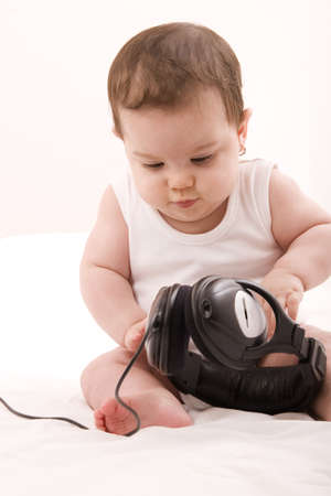 little girl listening to musicの写真素材
