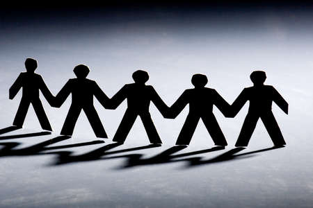 Group of male paper chain representing teamwork.の写真素材