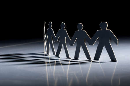 Group of male paper chain representing teamwork.の写真素材