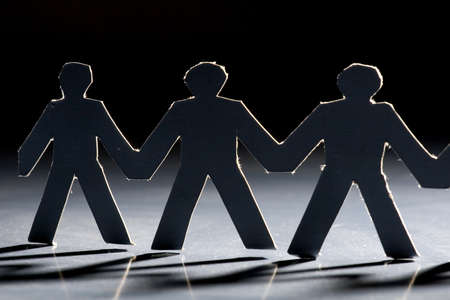 Group of male paper chain representing teamwork.の写真素材