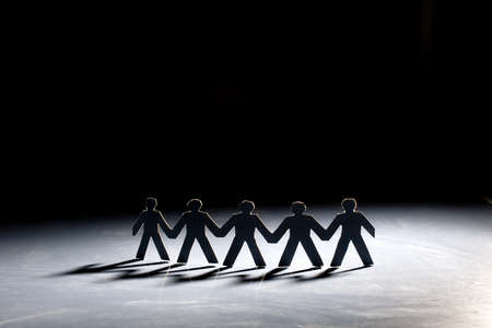 Group of male paper chain representing teamwork.の写真素材