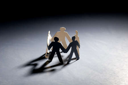 Group of male paper chain representing teamwork.の写真素材