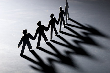 Group of male paper chain representing teamwork.の写真素材