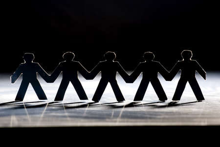 Group of male paper chain representing teamwork.の写真素材