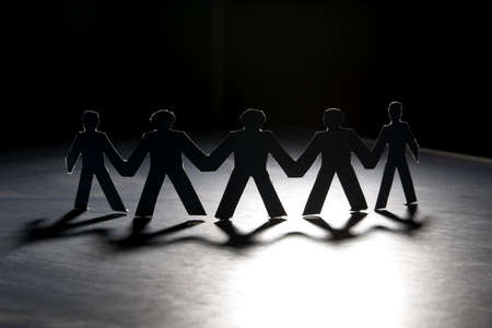 Group of male paper chain representing teamwork.の写真素材