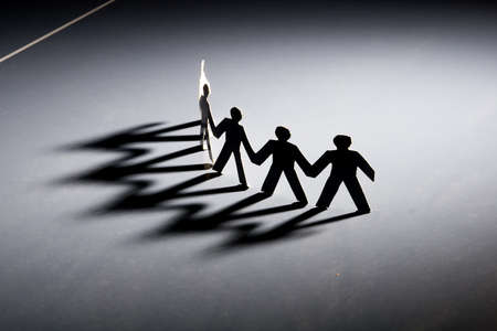 Group of male paper chain representing teamwork.の写真素材