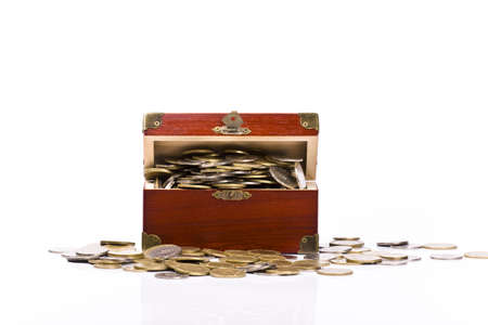  Wooden chest with coins inside isolatedの写真素材