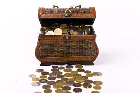  Wooden chest with coins inside isolatedの写真素材