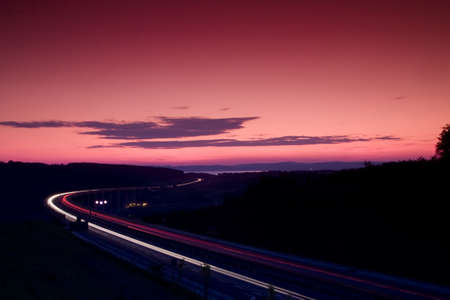 Cars speeding on a highwayの写真素材