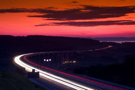 Cars speeding on a highwayの写真素材