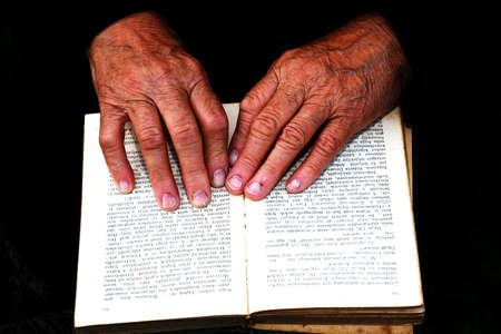 old hands and bibleの写真素材