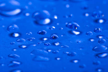 Water drops on metallic surfaceの写真素材